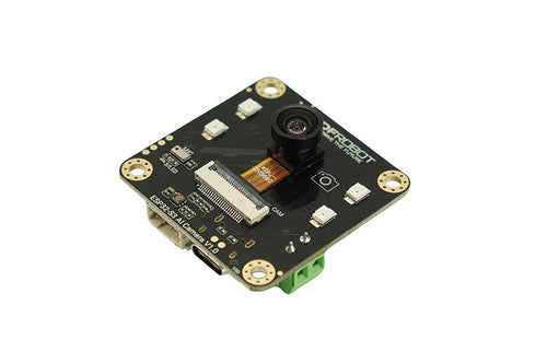 A Raspberry Pi camera module with a black PCB, featuring a central lens, gold screw terminals, a white GPIO header, and a green terminal block connector, shown on a plain white background.